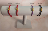 String Bracelet with Gold Plated Lucky Charms and Clasp